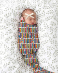 Rainbow Bookshelf swaddle blanket